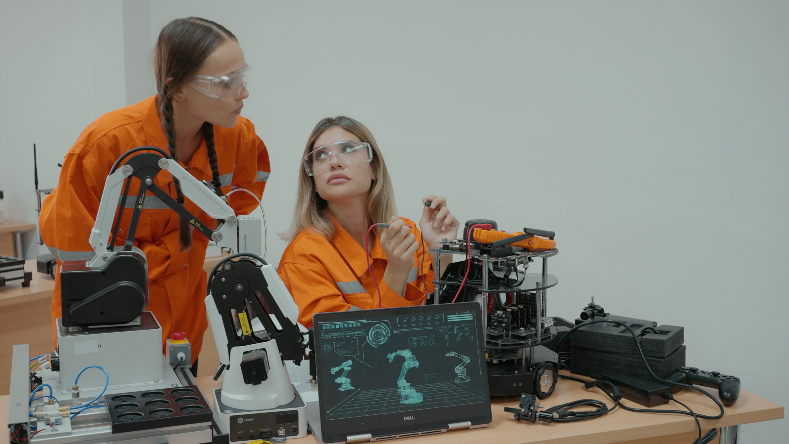 Engineers discussing and creating robotic devices